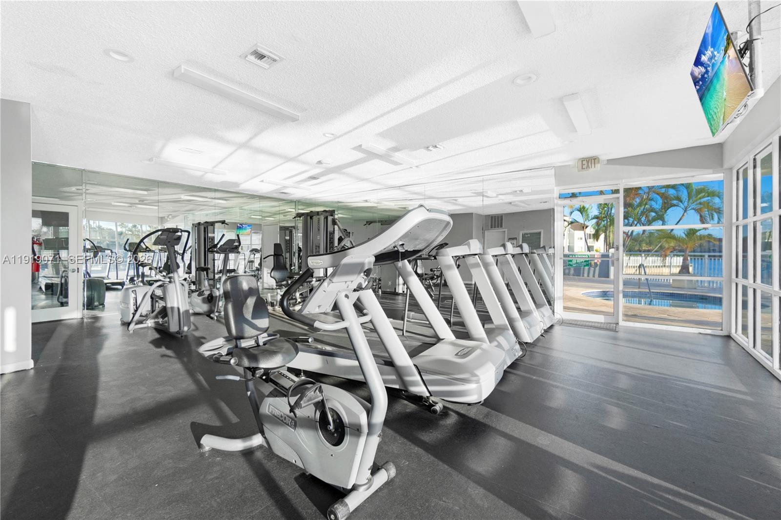 8560 Southwest 212th Street, Unit 308 Cutler Bay, FL 33189 - Photo 18 of 21 a view of a room with gym equipment