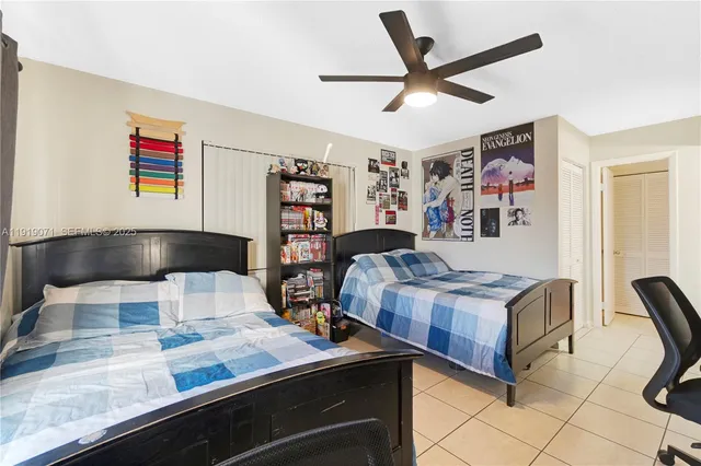 a living room with stainless steel appliances furniture and a rug