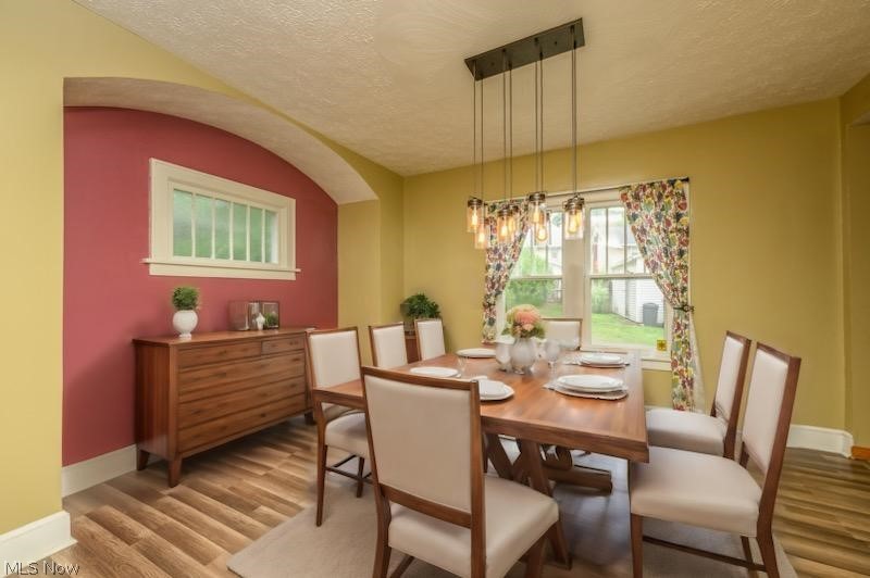 1222 Ridge Road Northwest Canton, OH 44703 - Photo 15 of 32 Dining room with vinyl flooring and hanging light with ai inserted furniture