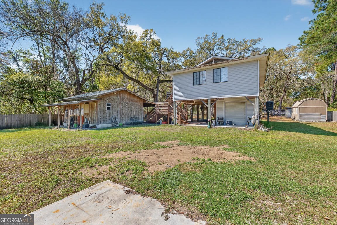33 Warren Avenue Waverly, GA 31565 - Photo 36 of 63 a view of a house with a yard