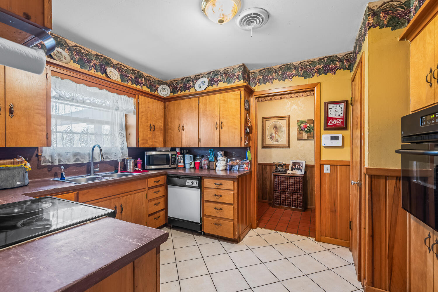 2513 52nd Street Lubbock, TX 79413 - Photo 13 of 29 a kitchen with stainless steel appliances granite countertop a refrigerator and a stove top oven
