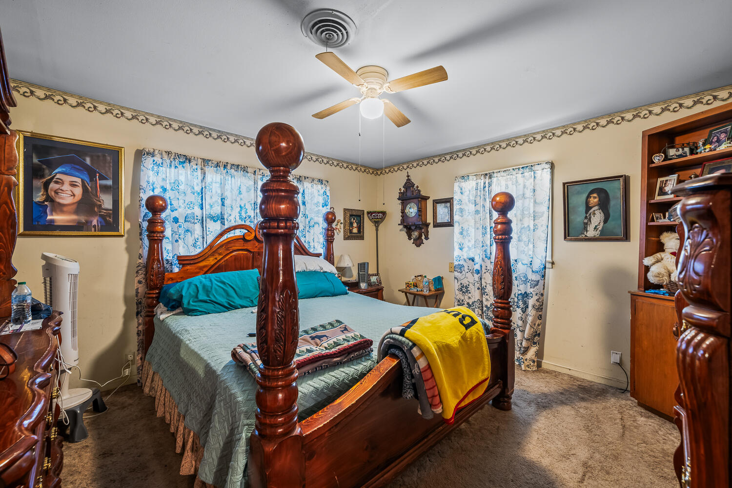 2513 52nd Street Lubbock, TX 79413 - Photo 16 of 29 a bedroom with bed and a chandelier