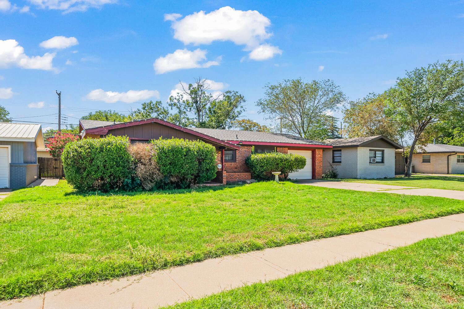 2513 52nd Street Lubbock, TX 79413 - Photo 2 of 29 a house view with a garden space