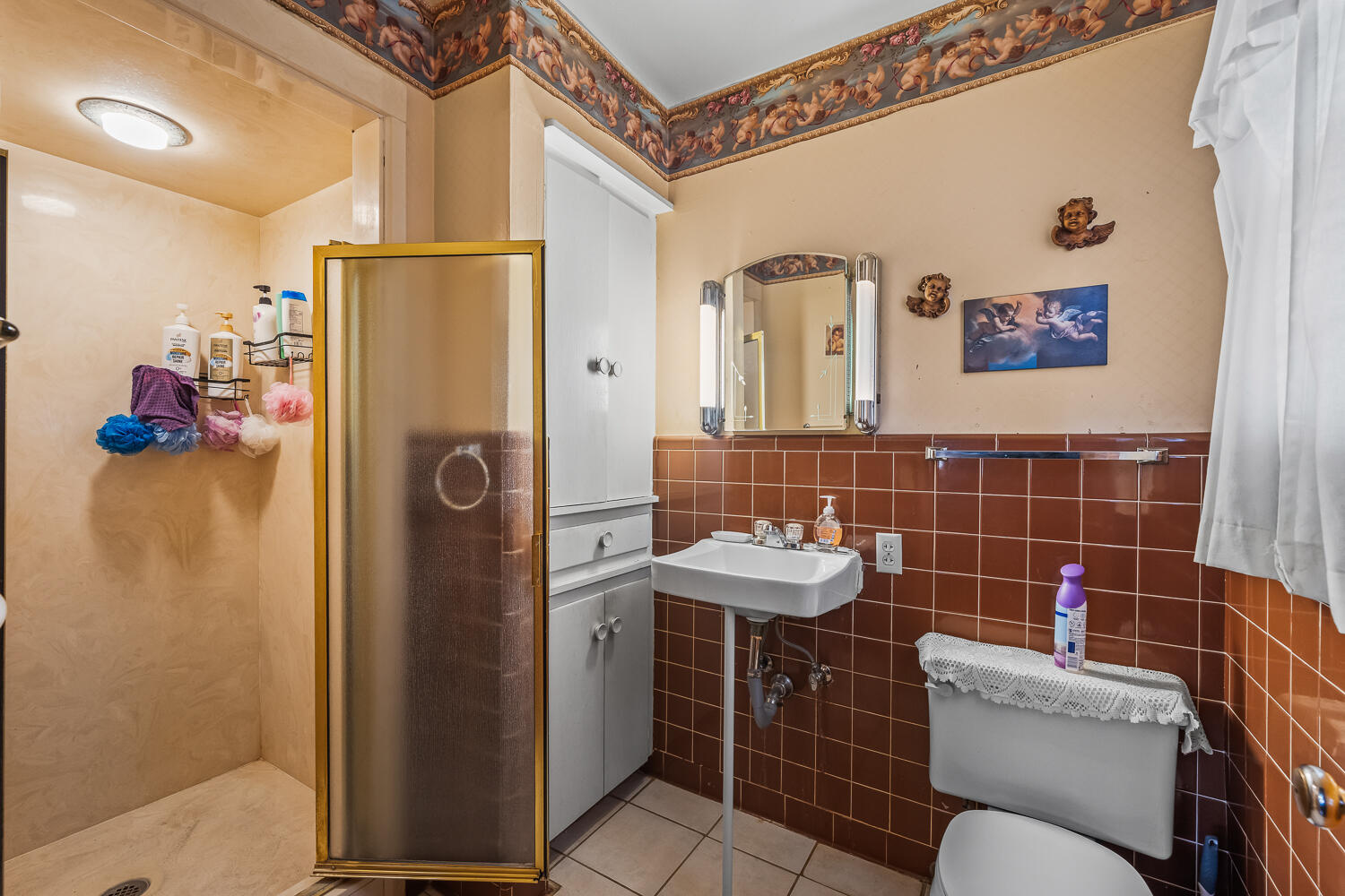 2513 52nd Street Lubbock, TX 79413 - Photo 22 of 29 a bathroom with a toilet sink and shower