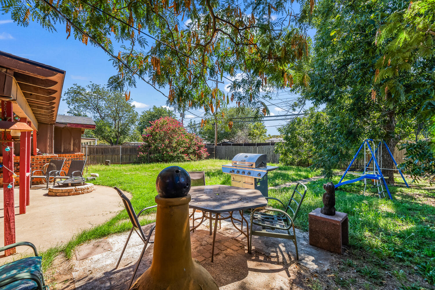 2513 52nd Street Lubbock, TX 79413 - Photo 25 of 29 a view of a chairs and table in backyard