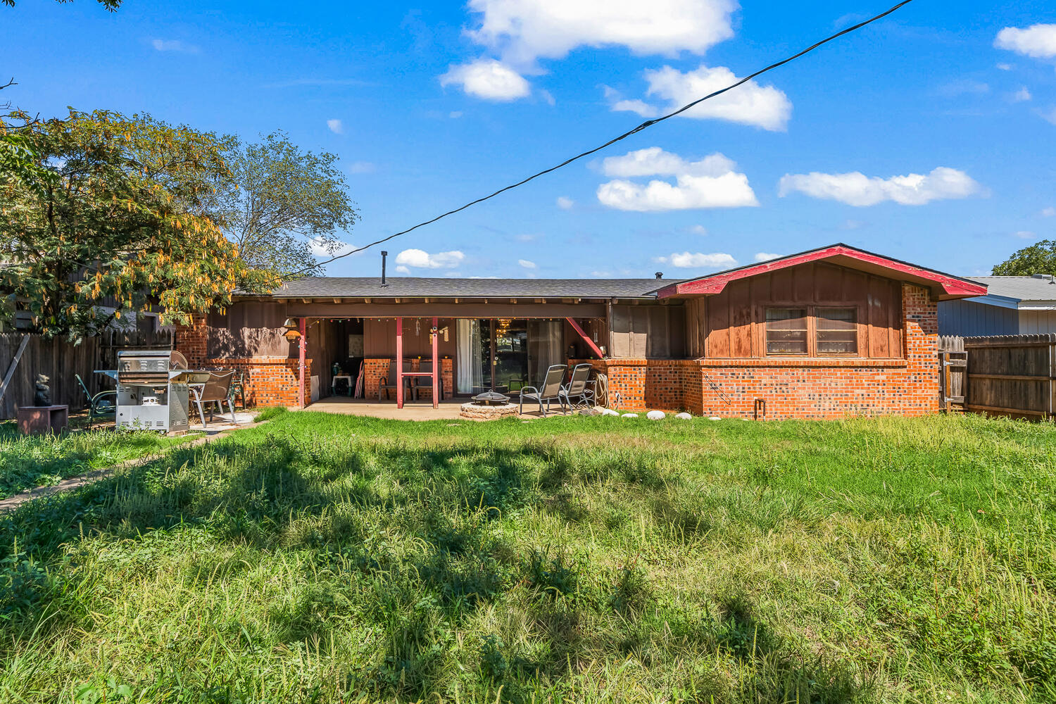 2513 52nd Street Lubbock, TX 79413 - Photo 27 of 29 a view of a house with backyard and sitting area