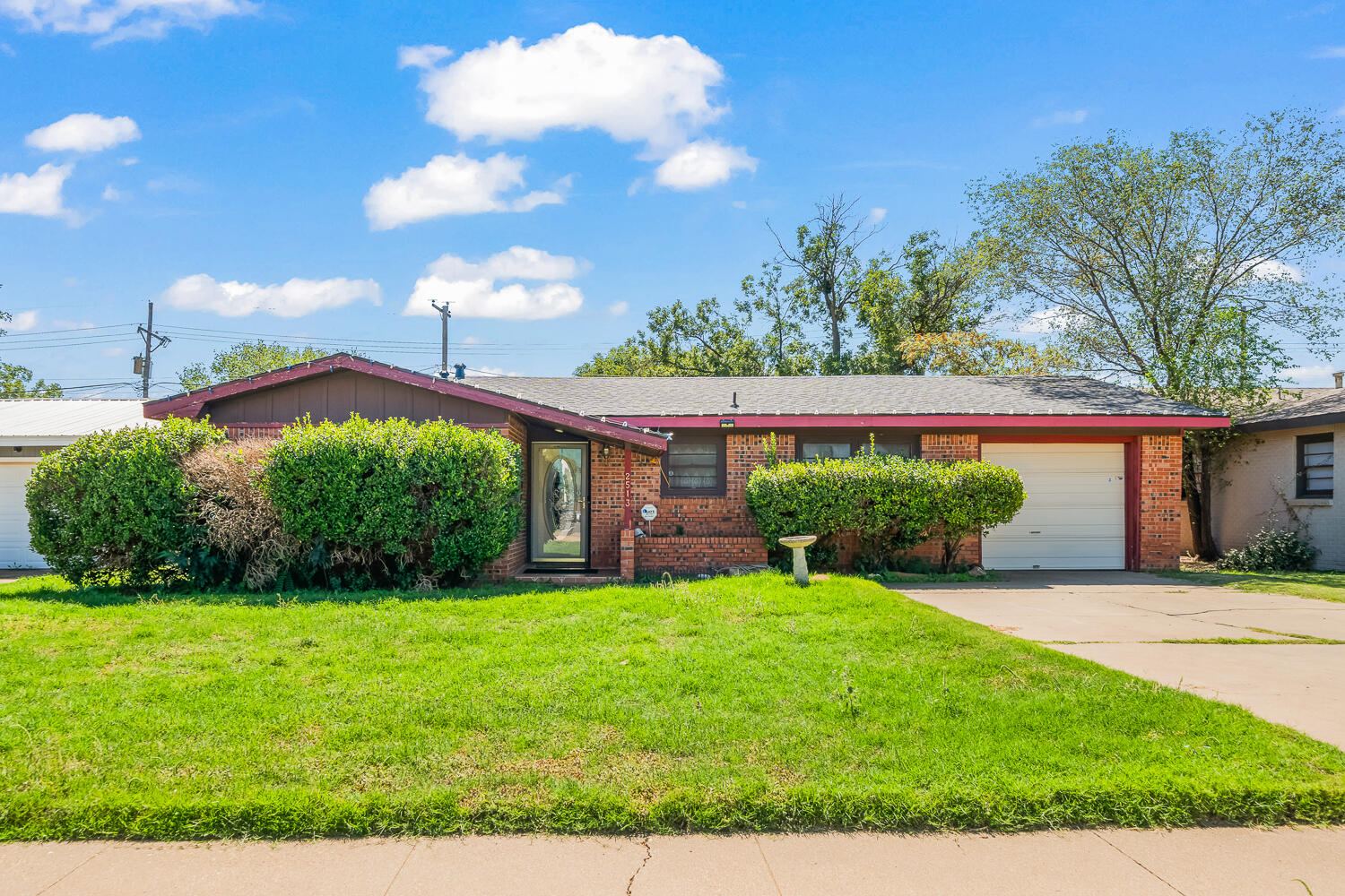 2513 52nd Street Lubbock, TX 79413 - Photo 4 of 29 a view of a house with a yard