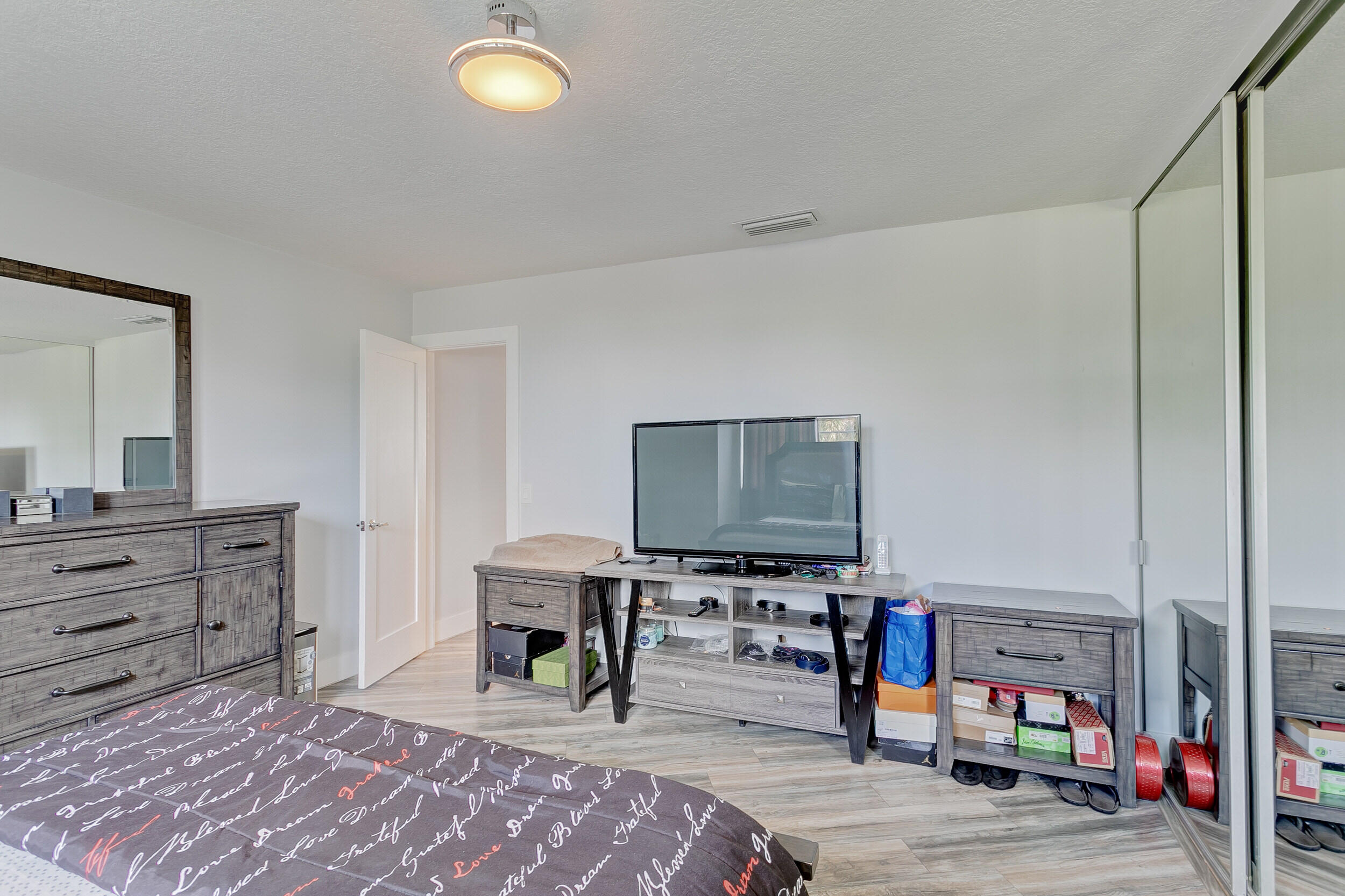 5050 Elmhurst Road, Unit D West Palm Beach, FL 33417 - Photo 19 of 28 Master Bedrom