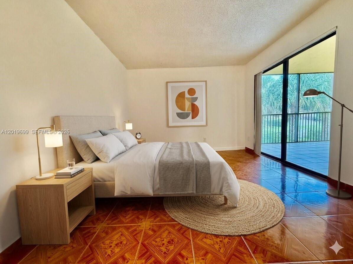 3470 Foxcroft Road, Unit 204 Miramar, FL 33025 - Photo 4 of 40 a bed room with a bed and a chair