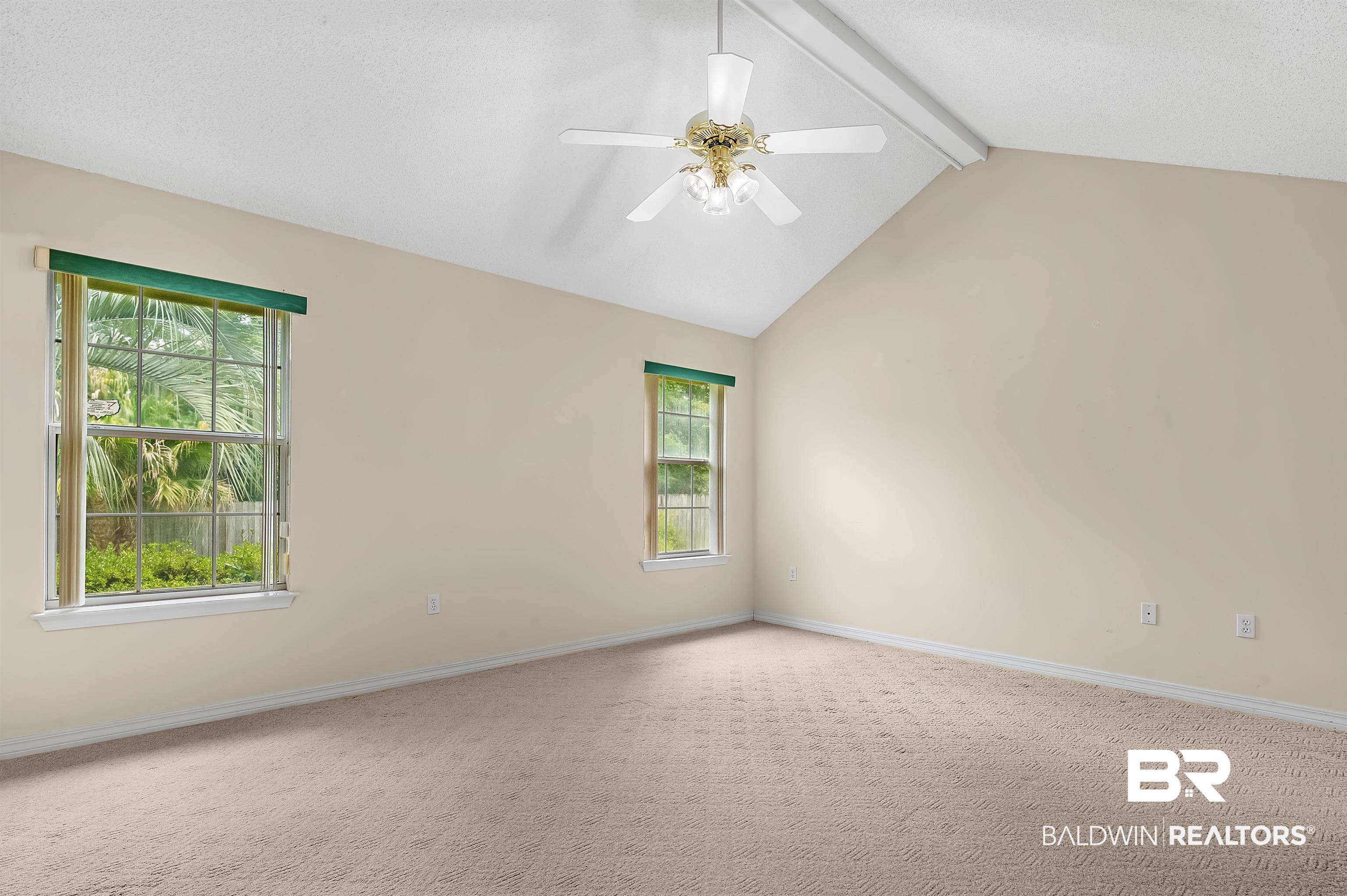 1502 Mulberry Lane Foley, AL 36535 - Photo 20 of 45 Carpeted featuring a healthy amount of sunlight, ceiling fan, and vaulted ceiling with beams