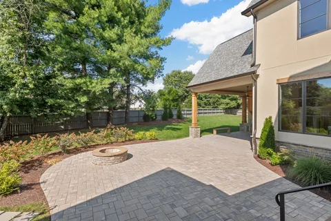 a view of a backyard with a garden and plants