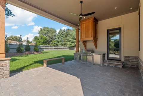 a view of a house with backyard porch and garden