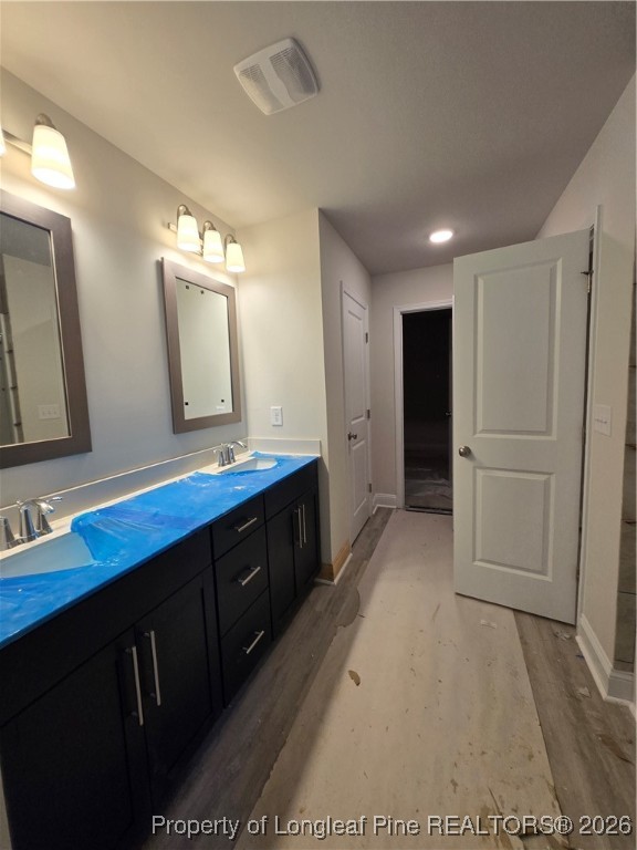 307 One Tree Hill Sanford, NC 27330 - Photo 7 of 15 a bathroom with a double vanity sink and mirror