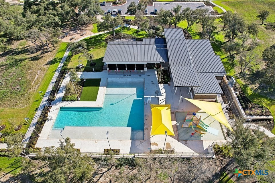 224 Escape Way Jarrell, TX 76537 - Photo 6 of 9 an aerial view of a house with swimming pool and large trees