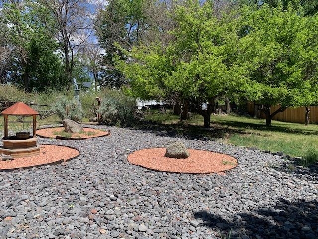 570 Southwest 2nd Court Cedaredge, CO 81413 - Photo 24 of 32 a backyard of a house with entertaining space and trees