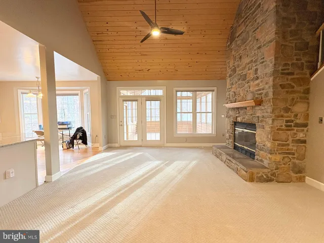 a bathroom with a sink a toilet and a window