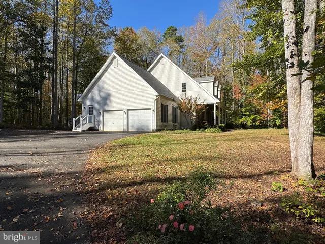 a view of a patio with a table and chairs