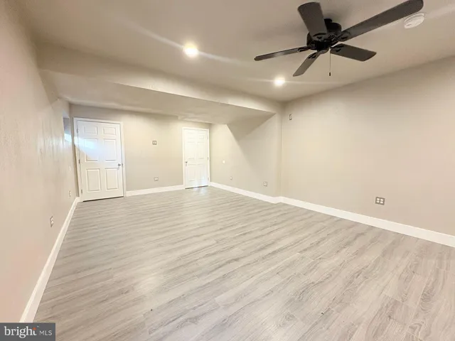 a backyard of a house with barbeque oven