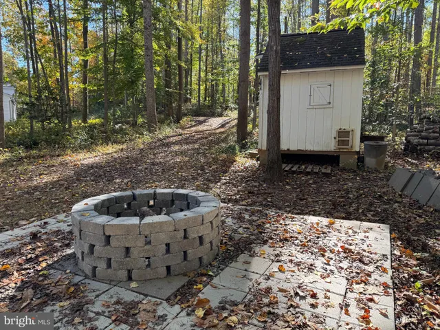 a view of a room with a ceiling fan and a window