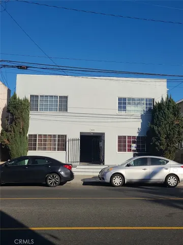 a view of a car parked in front of a house