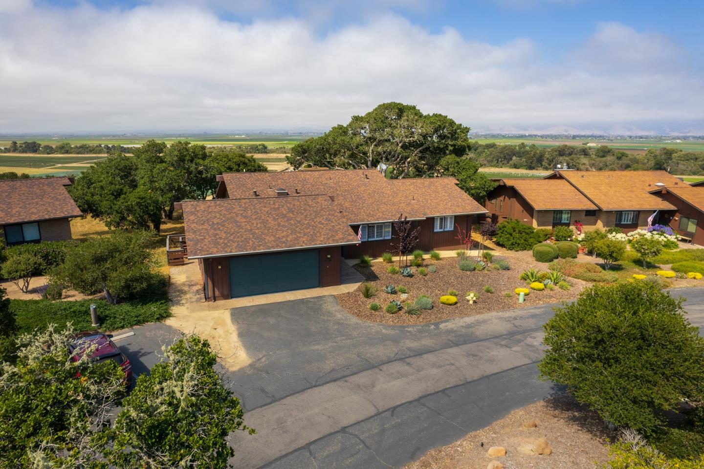 14170 Reservation Road Salinas, CA 93908 - Photo 2 of 22 an aerial view of a house with a garden