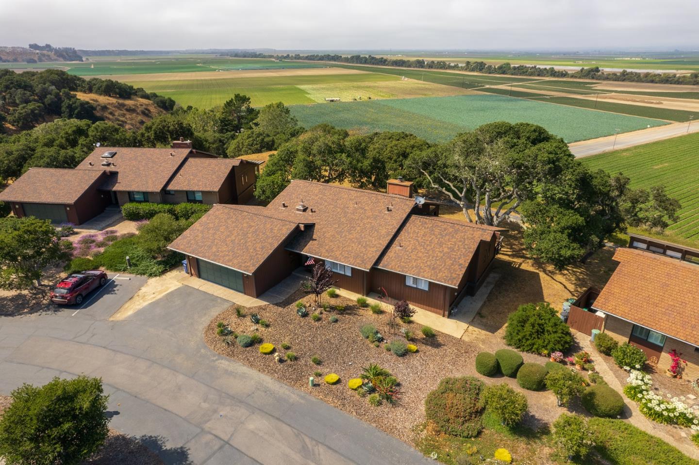 14170 Reservation Road Salinas, CA 93908 - Photo 3 of 22 an aerial view of a house with garden space and ocean view