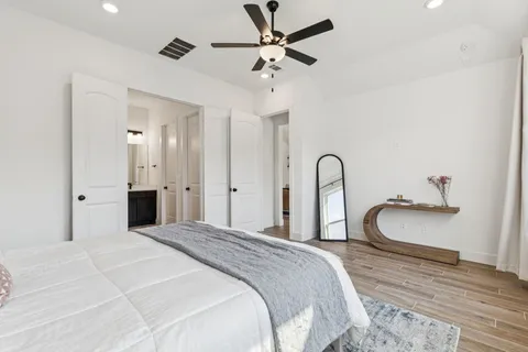 a bedroom with a bed and a window