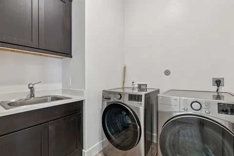 a bathroom with a sink toilet and mirror