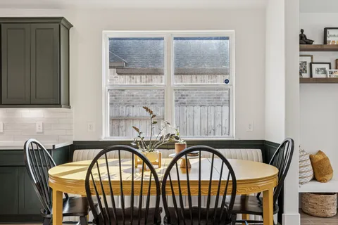 a kitchen with sink stove and cabinets