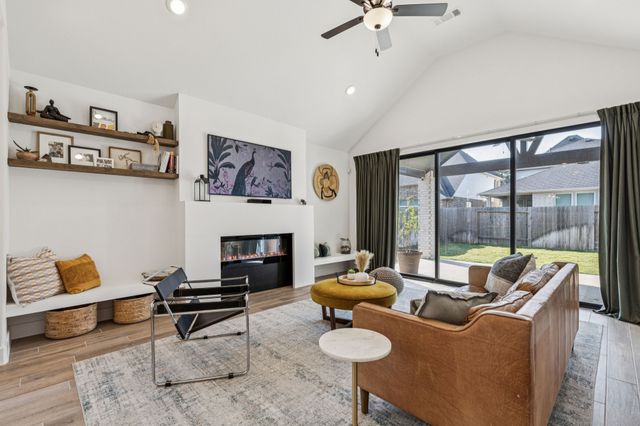 a view of a dining room with furniture and a window