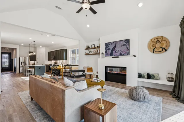 a living room with furniture and a fireplace