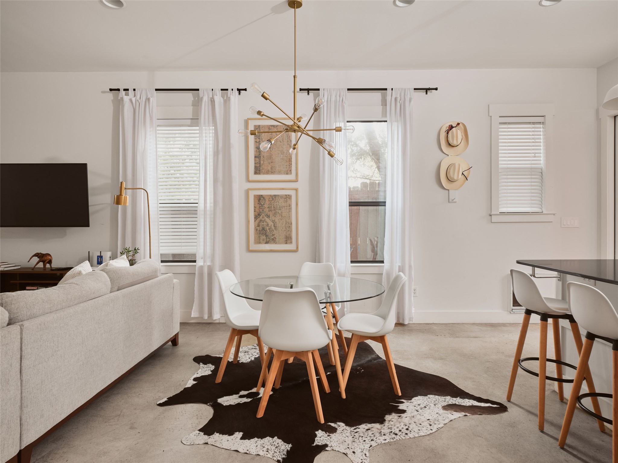 2002 East 13th Street, Unit A Austin, TX 78702 - Photo 10 of 37 Dining room featuring a chandelier, concrete floors, and recessed lighting