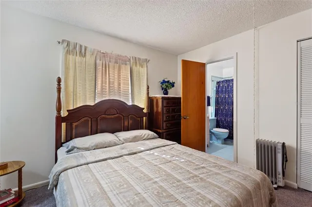 a view of a house with backyard and garden