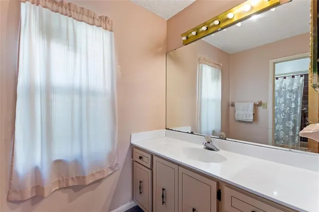 a view of a lake with a house in the background