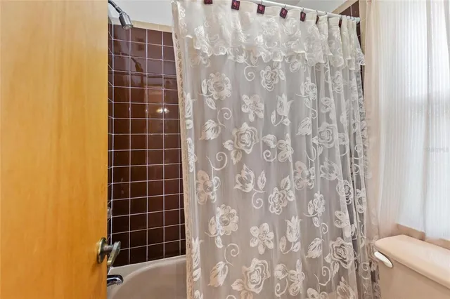 a view of a lake with a house in a yard