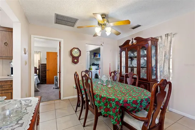 a kitchen with a refrigerator a sink and cabinets