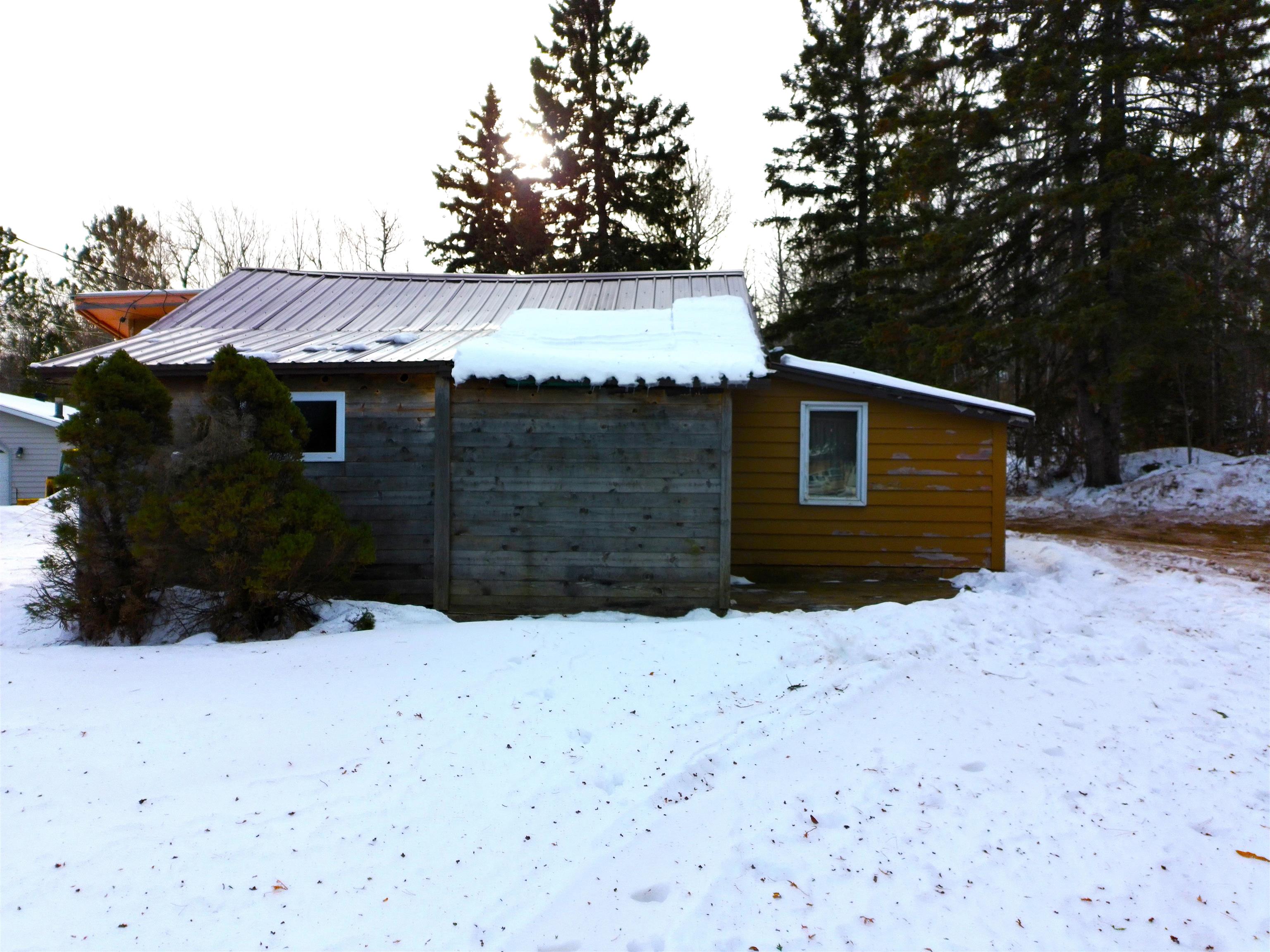 3946 East Calvary Road Duluth, MN 55803 - Photo 12 of 12 Snow covered property featuring a metal roof