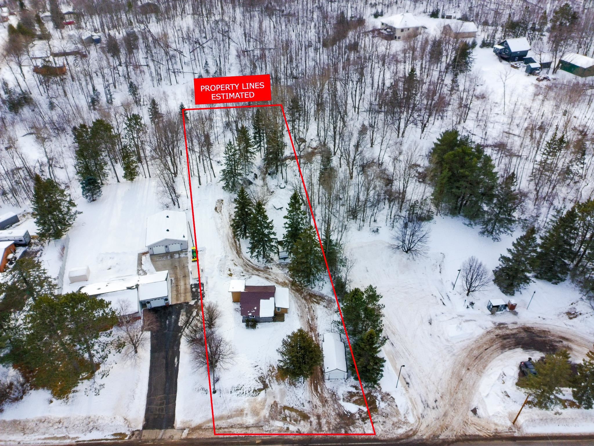 3946 East Calvary Road Duluth, MN 55803 - Photo 2 of 12 Snowy aerial view with property parcel outlined