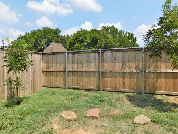 a backyard of a house with lots of green space
