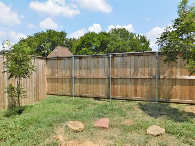 a backyard of a house with lots of green space