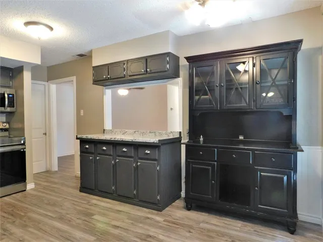 a bathroom with a sink vanity and a mirror