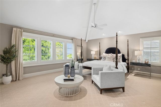 a bathroom with sink mirror and window