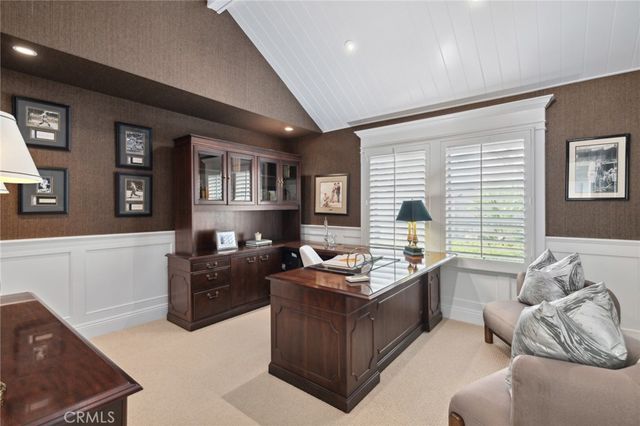 a view of a hallway with seating area