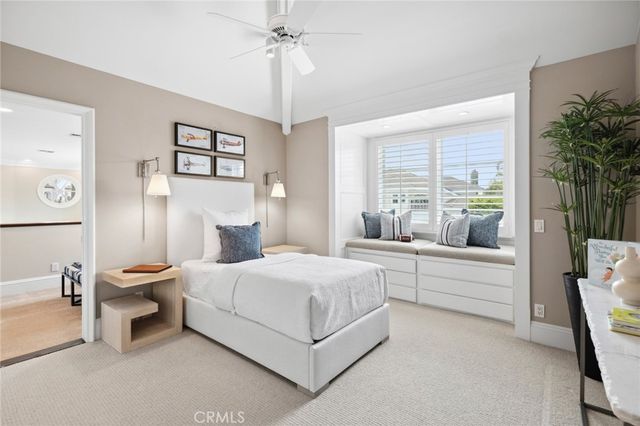 a room with pool table and windows