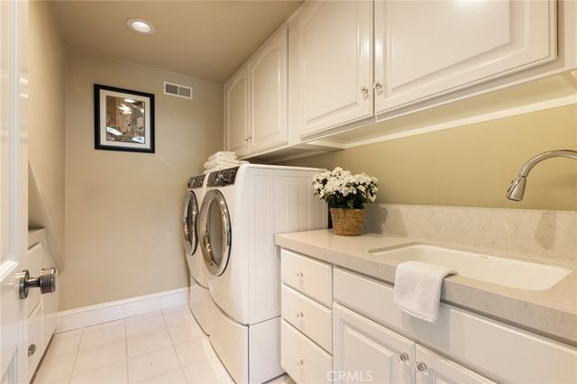 a view of a yard with plants and trees