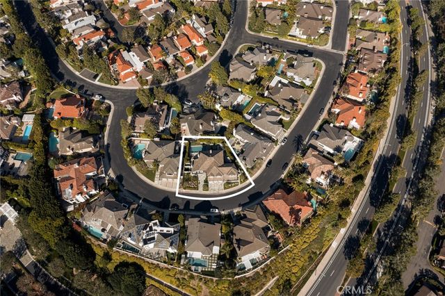 a view of a house with backyard sitting area and garden