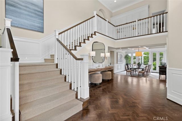 a view of entryway livingroom and hall with wooden floor