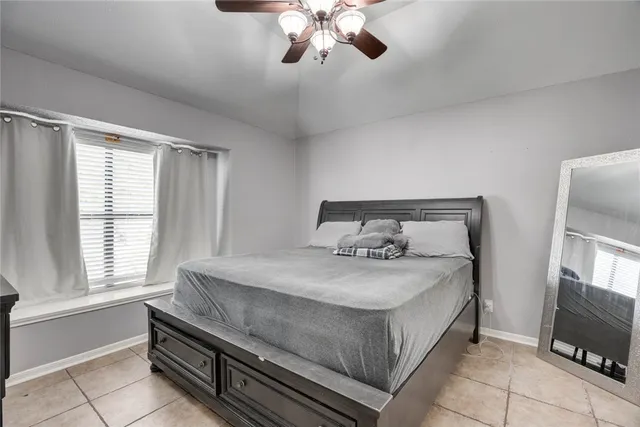 a bathroom with a double vanity sink toilet mirror and bathtub
