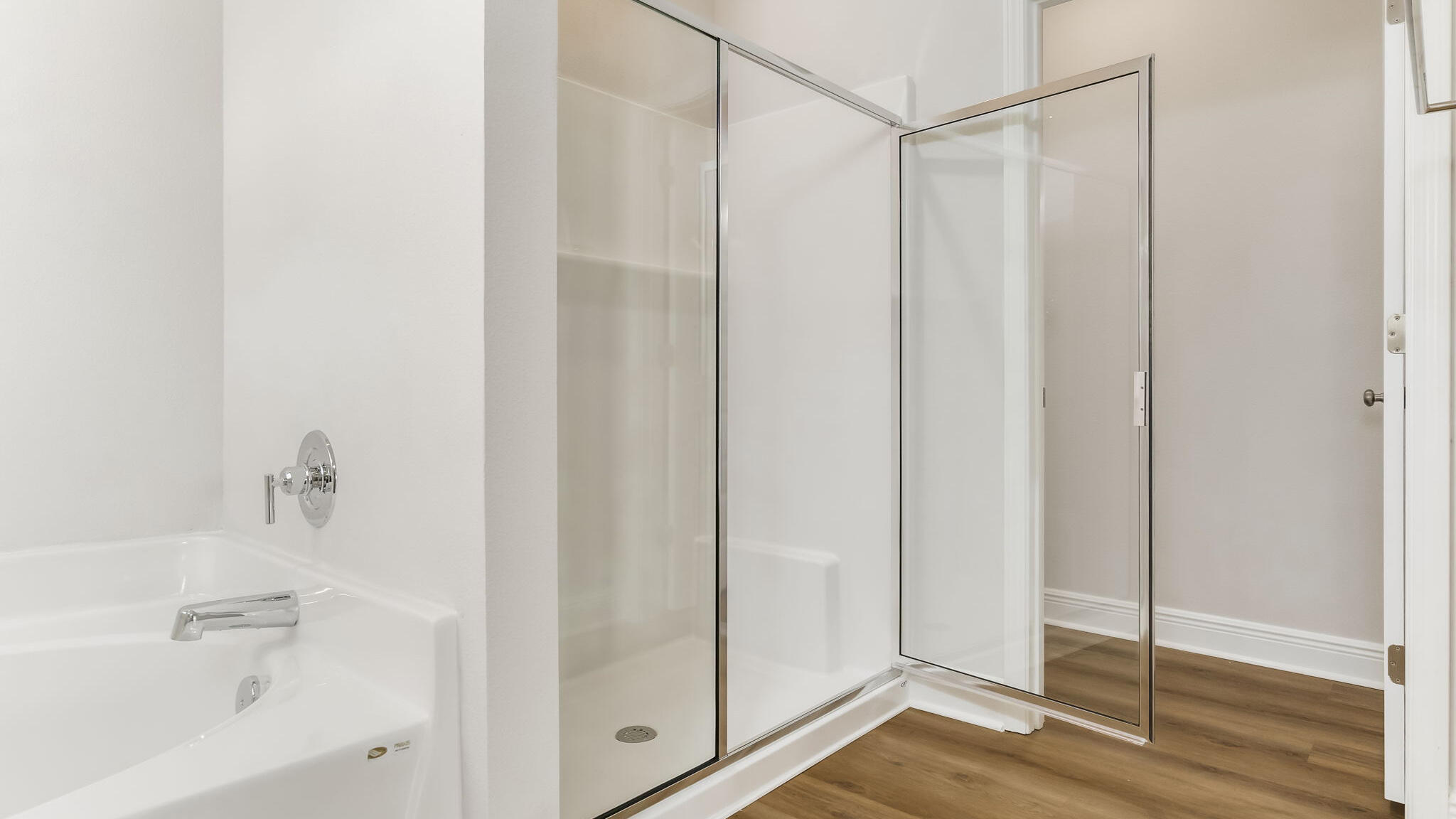 5619 Thatcher Road Crestview, FL 32539 - Photo 19 of 32 a bathroom with a glass shower door