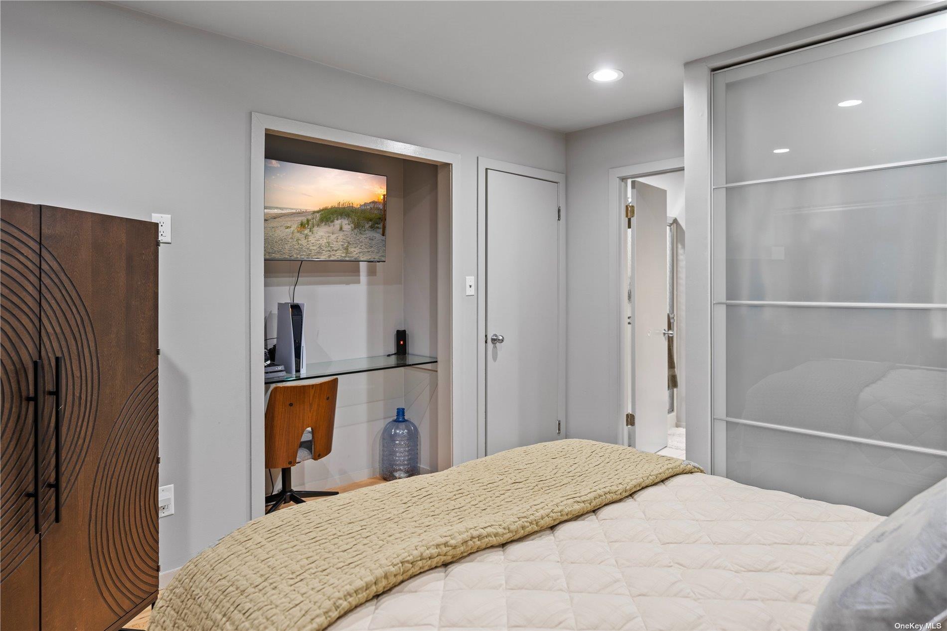 25 North Quarter Road Westhampton, NY 11977 - Photo 12 of 27 a bedroom with a bed and a dresser